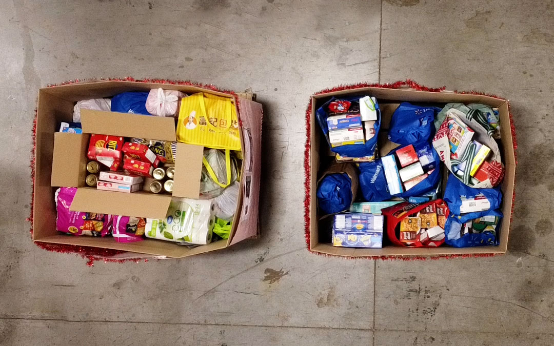An image of two corrugated bins filled with food donations.