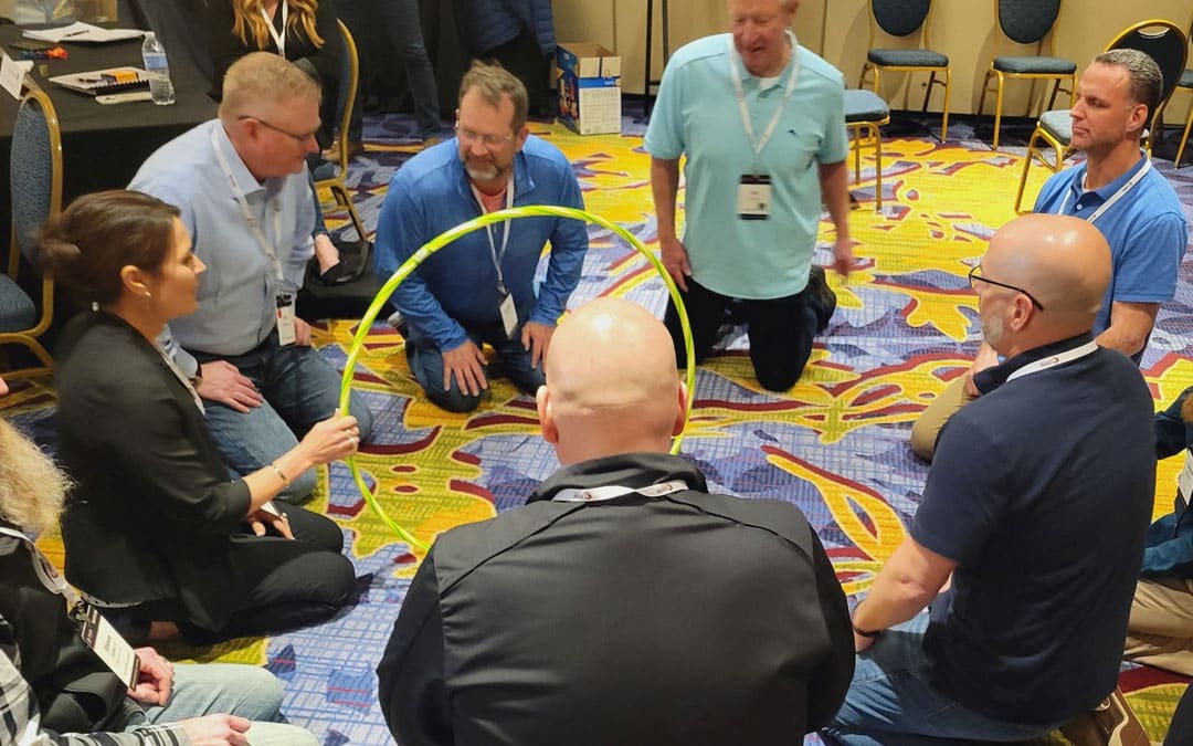 PDA Leadership Training Program attendees participating in a group exercise.